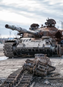 damaged military tank on a city street in Ukraine photo