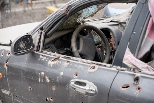 damaged and looted cars in a city in Ukraine during the war photo