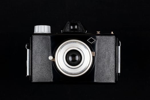 Vintage Film Camera isolated on black background photo
