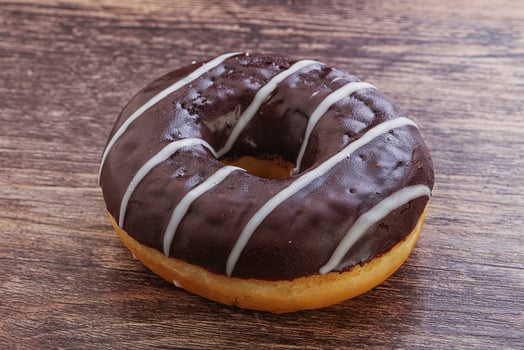 Glazed sweet tasty chocolate donut photo