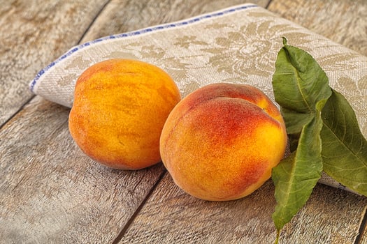 Two ripe sweet peaches fruit photo