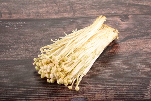 Tasty raw enoki mushroom heap photo