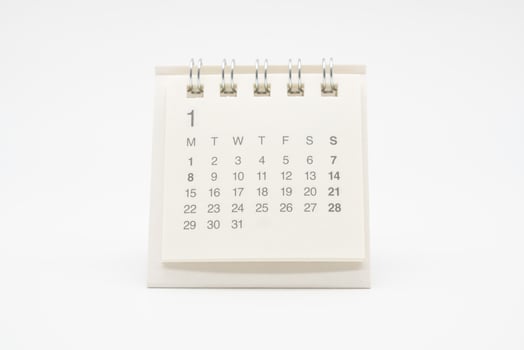 Simple desk calendar with no year isolated on white background. Calendar concept with copy space. photo