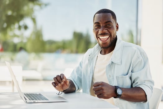 Man modern cheerful person laptop happy internet sitting young computer portrait business adult male photo