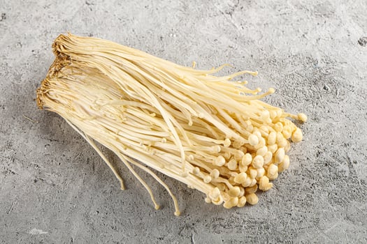 Tasty raw enoki mushroom heap photo
