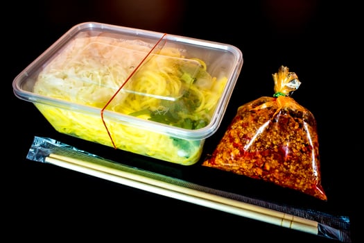 Spaghetti with sauce Take home food in plastic packaging photo