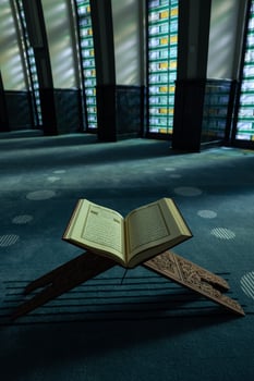 Ramadan or islamic vertical concept photo. The Holy Quran on the book stand photo