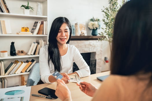 woman is paying cash and credit card to make a purchase. financial concept photo