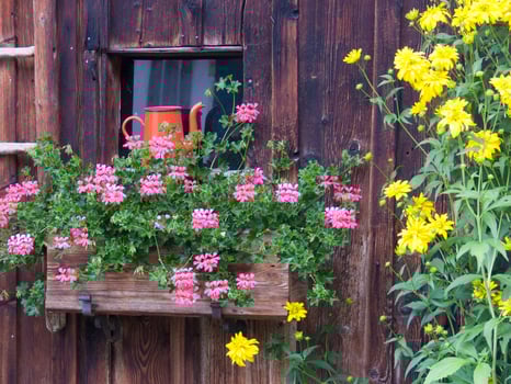 a wooden window with a flower box on it photo