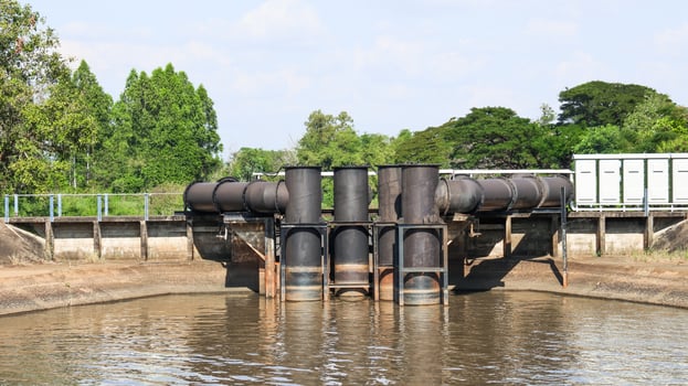 Black water pumps pipes are in the small river photo