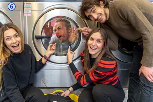 group of friends in the laundry room having fun photo