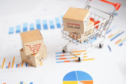 Online shopping, Shopping cart box on business graph, import export, finance commerce. photo