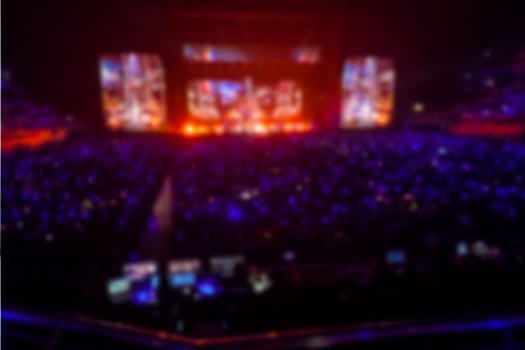Stage with shining lights and a crowd photo