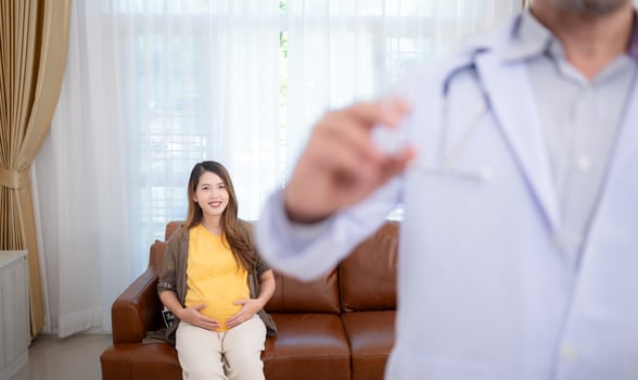 Obstetrician gynecologist and vaccination needle or pregnant woman, Asian pregnant woman visit gynecologist doctor at medical clinic for pregnancy consultant. photo