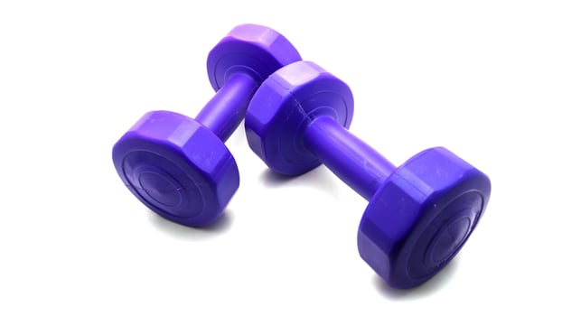 Isolated Dumbbell Concept. Fitness Equipment for Gym Workout, Strength Training, Bodybuilding, and Powerlifting photo