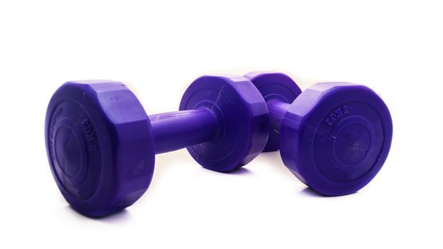 Isolated Dumbbell Concept. Fitness Equipment for Gym Workout, Strength Training, Bodybuilding, and Powerlifting photo