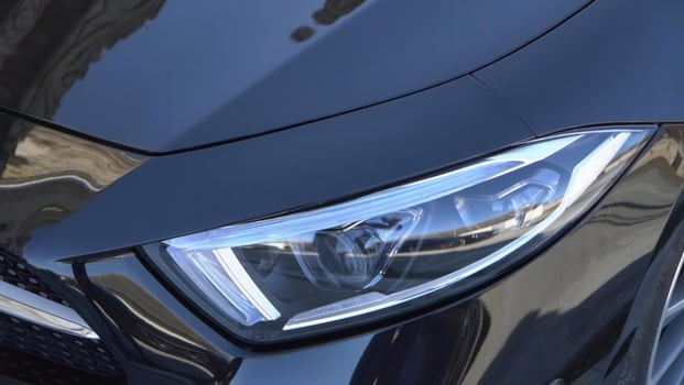 AI generated Close up of the headlights of a modern car, selective focus photo