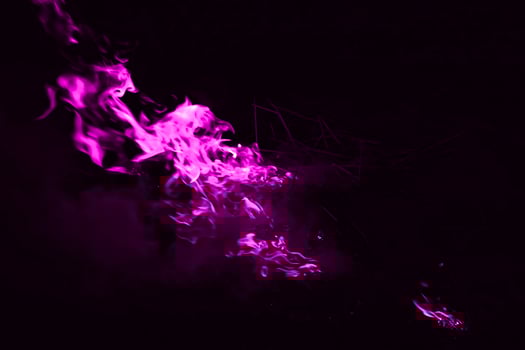 Violet flame. Burning of rice straw at night. photo