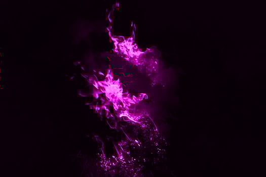 Violet flame. Burning of rice straw at night. photo