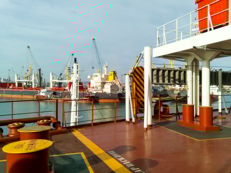 View of the sea and city beach from the port quay. Industrial po photo