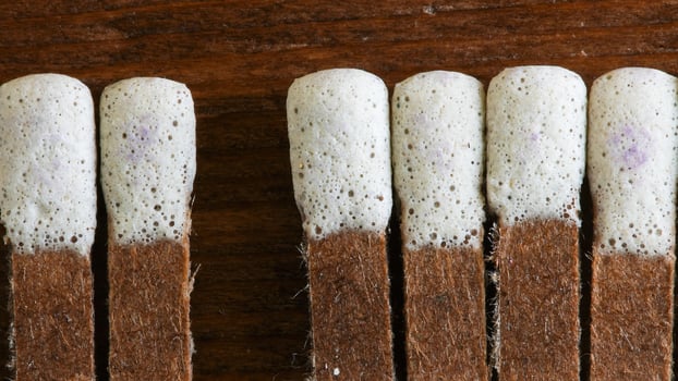 Macro close up from matches on wooden background with copy space photo