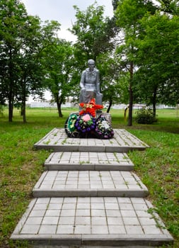 Monument to the Mother of a Soldier waiting for her son from the war. Sculpture of an unknown author in the park of the village of Pervomaisky, Krasnodar Krai, Russia. photo