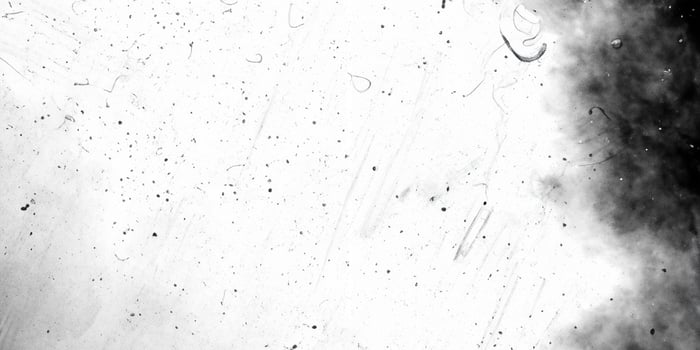 Dirty monochrome overlay screen effect use for grunge background and vintage style. Abstract dust particle and dust grain texture with white center and black borders photo
