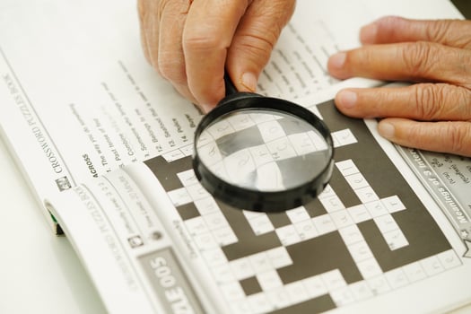 Bangkok, Thailand - May 15, 2022 elderly woman playing sudoku puzzle game for treatment dementia prevention and Alzheimer disease. photo