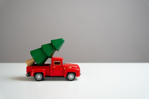 An old pickup truck is carrying a christmas tree. Christmas and new year. Preparation for celebrating the holidays. Tourism and travel. photo
