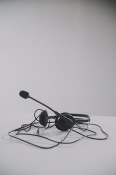 Communication support, call center and customer service help desk. VOIP headset on telephone keyboard. photo