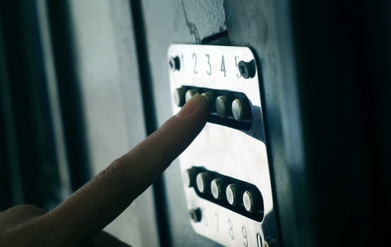 Applying security code on the door photo