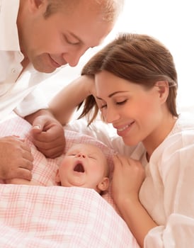 Newborn baby with parents photo