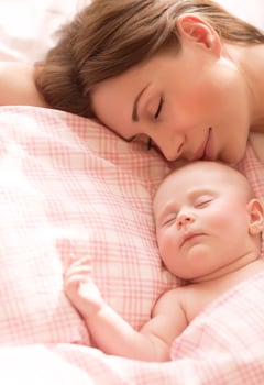 Mother with baby sleeping photo