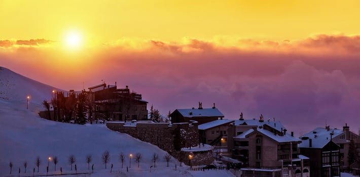 Beautiful sunset in snowy mountainous village photo