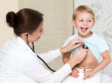 Sweet child visiting doctor photo