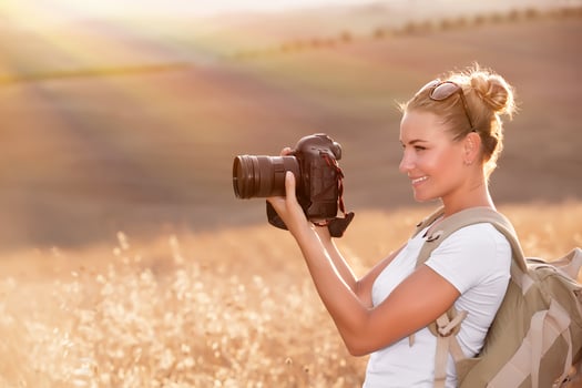 Happy photographer enjoying nature photo