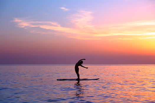 Doing yoga asanas on the beach photo