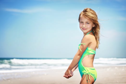 Cute little girl on a beach photo