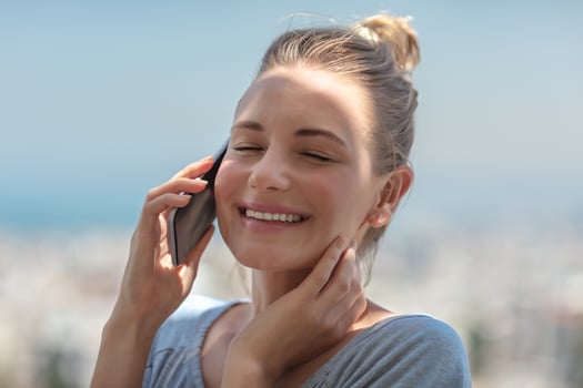 Cheerful girl talking on the phone photo