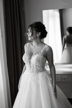 bride in a white dress at the training camp photo