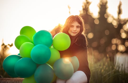 Pretty girl with air balloons photo