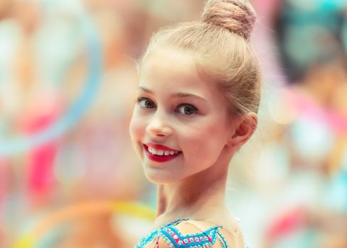 Portrait of a happy gymnast girl photo