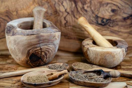 caraway seeds Carum carvi on olive wood photo