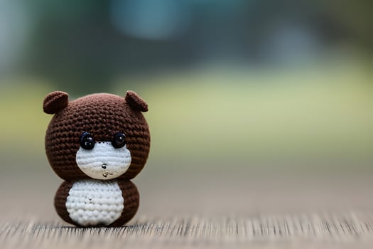 AI generated Crocheted Teddy Bear on Light Background photo
