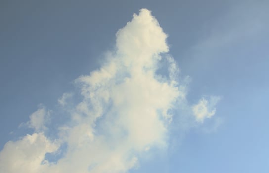 The masses of white smoke released into the air from the pipes of an industrial plant photo