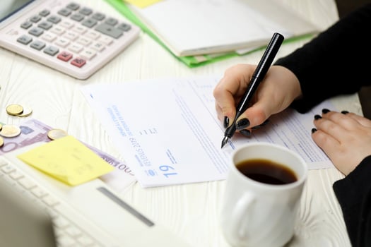Accountant fill french tax form 2042 NR departure abroad or return to France in end of tax period. Taxation and paperwork routine photo