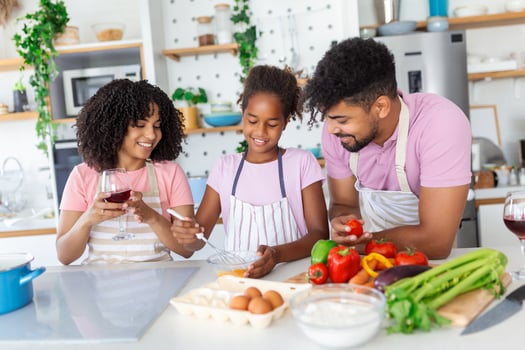 Family In Kitchen Making Morning Breakfast Together. Happy family in the kitchen having fun and cooking together. Healthy food at home. photo