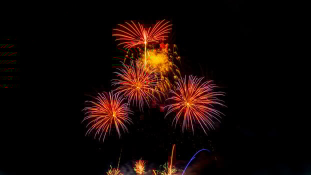 fireworks on the river in the dark sky photo