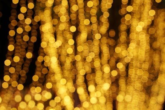 Abstract blurred and bokeh of party yellow LED reflection lighting on night time background. photo
