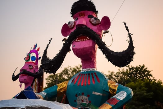 Ravnans being ignited during Dussera festival at ramleela ground in Delhi, India, Big statue of Ravana to get fire during the Fair of Dussera to celebrate the victory of truth by Lord Rama photo